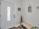Charming home entryway with decorative door, bench, and stylish accents at 1204 50Th E St, Bradenton, FL 34208