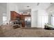 Kitchen with granite counters flows to dining with stainless appliances at 1204 50Th E St, Bradenton, FL 34208