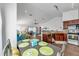 Open concept kitchen flows into living area with granite countertops and stainless appliances at 1204 50Th E St, Bradenton, FL 34208