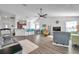 Spacious living room with hardwood floors and views into the kitchen and dining area at 1204 50Th E St, Bradenton, FL 34208