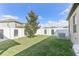 Well-maintained backyard with healthy lawn and full white fence at 13218 Satin Lily Dr, Riverview, FL 33579