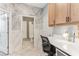 Bathroom area featuring a stylish workspace and a glimpse into the shower area at 13218 Satin Lily Dr, Riverview, FL 33579