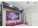 Cozy bedroom with a built-in murphy bed and decorative artwork at 13218 Satin Lily Dr, Riverview, FL 33579