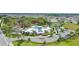Community clubhouse featuring a pool, ample parking, and well-maintained landscaping at 13218 Satin Lily Dr, Riverview, FL 33579