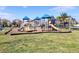 Community playground with slides, climbing wall, and other amenities at 13218 Satin Lily Dr, Riverview, FL 33579