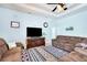 Spacious living room with large screen television, coffered ceiling, and tile flooring at 13855 Rudi Loop, Spring Hill, FL 34609