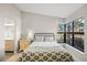 Bright bedroom with a view of the surrounding landscape showcasing natural light and airy ambiance at 14766 Feather Cove Ln, Clearwater, FL 33762