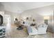 Inviting living room with neutral tones, stylish furnishings and seamless access to the dining area at 14766 Feather Cove Ln, Clearwater, FL 33762