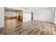 Inviting living room featuring wood-look flooring, wainscotting and an open layout for easy entertaining at 1801 38Th N St, St Petersburg, FL 33713