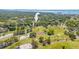 A home close to a golf course and coastal area, is featured in this aerial view of the neighborhood at 2016 Culberson Ave, Dunedin, FL 34698