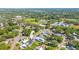 A lovely home with a pool is highlighted in an aerial view of the property and surrounding neighborhood at 2016 Culberson Ave, Dunedin, FL 34698