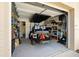 Well-organized garage space with ample storage, a golf cart, and a clean, open layout at 2016 Culberson Ave, Dunedin, FL 34698