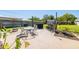 Outdoor patio features a dining set and a separate bar area, all set on a concrete base at 2016 Culberson Ave, Dunedin, FL 34698