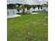 Inviting backyard with picnic tables and picturesque views of the water at 2102 W Ivy St, Tampa, FL 33607