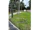 Expansive backyard with a shed, grass, and privacy fence at 2102 W Ivy St, Tampa, FL 33607