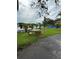 Serene backyard with picnic tables and ample green space along the waterfront at 2102 W Ivy St, Tampa, FL 33607
