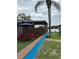 Inviting backyard featuring an outdoor table and chairs near the lake at 2102 W Ivy St, Tampa, FL 33607