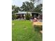 Expansive lawn and patio area, ideal for outdoor entertaining or relaxed living at 2102 W Ivy St, Tampa, FL 33607