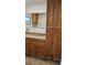Bathroom vanity featuring granite counters and wood cabinetry at 2102 W Ivy St, Tampa, FL 33607