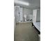 Bedroom featuring essential amenities including a bed, shower, toilet, sink, and wardrobe at 2102 W Ivy St, Tampa, FL 33607