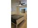 Bright bedroom with a ceiling fan and natural light at 2102 W Ivy St, Tampa, FL 33607