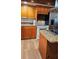 Close-up of a kitchen with stainless-steel appliances and wooden cabinetry at 2102 W Ivy St, Tampa, FL 33607