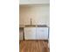 Efficient kitchenette featuring white cabinets and granite countertops at 2102 W Ivy St, Tampa, FL 33607