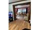 An open-concept living space with hardwood floors, perfect for dining and relaxing at 2102 W Ivy St, Tampa, FL 33607