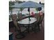 Outdoor patio featuring an oval table and seating with a beautiful view of the lake at 2102 W Ivy St, Tampa, FL 33607