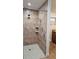 Custom tiled shower with dual showerheads and built-in shelving at 2102 W Ivy St, Tampa, FL 33607