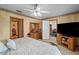 Spacious bedroom with two doorways and wooden furniture at 2940 Bay View Dr, Safety Harbor, FL 34695