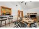 Open-concept dining area with bar, table, and tile flooring at 2940 Bay View Dr, Safety Harbor, FL 34695