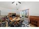 The dining room features a table for four, tile floors, and a sliding door that leads to the lanai at 2940 Bay View Dr, Safety Harbor, FL 34695