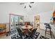 Bright dining area featuring tile flooring, table with seating, and access to the backyard at 2940 Bay View Dr, Safety Harbor, FL 34695