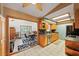 Eat-in kitchen boasts bright lighting, oak cabinets, and black appliances at 2940 Bay View Dr, Safety Harbor, FL 34695