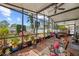Enclosed patio with hot tub and greenery at 2940 Bay View Dr, Safety Harbor, FL 34695