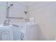 Close-up of the bathroom's walk-in bathtub with safety features and easy access at 31841 Larkenheath Dr, Wesley Chapel, FL 33543