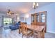 Spacious dining area with backyard views, adjacent to the living room, perfect for Gathering meals at 31841 Larkenheath Dr, Wesley Chapel, FL 33543