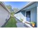 Charming single-story home with a landscaped walkway leading to the front door at 31841 Larkenheath Dr, Wesley Chapel, FL 33543