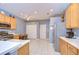 Bright kitchen featuring stainless steel appliances and neutral toned walls with a view to eating area at 31841 Larkenheath Dr, Wesley Chapel, FL 33543