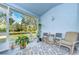 Screened-in lanai with serene views of the pond at 31841 Larkenheath Dr, Wesley Chapel, FL 33543