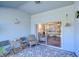Screened-in lanai with sliding glass doors to living area at 31841 Larkenheath Dr, Wesley Chapel, FL 33543