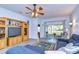 Cozy Gathering room featuring a wall-mounted entertainment center and sliding glass doors to lanai at 31841 Larkenheath Dr, Wesley Chapel, FL 33543