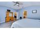 A view into the main bedroom, with a view to the living area, and main bath at 31841 Larkenheath Dr, Wesley Chapel, FL 33543