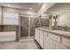 Modern bathroom with tiled shower, soaking tub, and double sink vanity with granite countertops at 3624 Autumn Amber Dr, Spring Hill, FL 34609