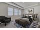 A staged bedroom features neutral tones, plush bedding, and decorative accents for a serene retreat at 3624 Autumn Amber Dr, Spring Hill, FL 34609