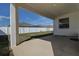 Covered patio with concrete flooring, perfect for outdoor seating and overlooking the backyard at 3624 Autumn Amber Dr, Spring Hill, FL 34609