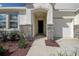 Inviting front entrance with stone accents and landscaped walkway at 3624 Autumn Amber Dr, Spring Hill, FL 34609