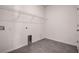 Laundry room featuring tile floors, electrical outlets, and a dryer hookup at 3624 Autumn Amber Dr, Spring Hill, FL 34609