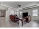 Bright living room with neutral walls, tile flooring, ceiling fan and stylish furnishings at 3624 Autumn Amber Dr, Spring Hill, FL 34609